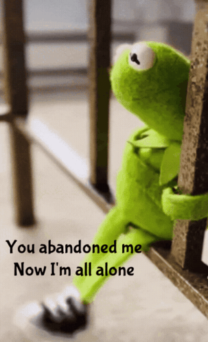 A Kermit The Frog Sitting On A Railing With The Words You Abandoned Me Now I 'M All Alone GIF