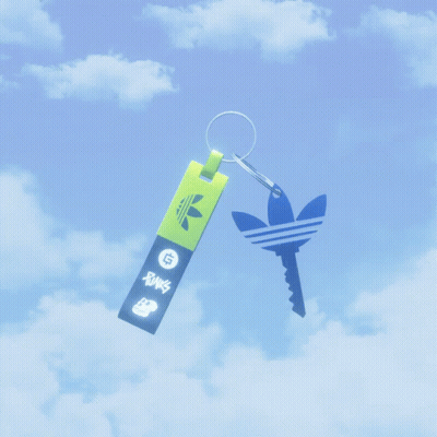 A Keychain With An Adidas Logo On It Is Floating In The Air GIF