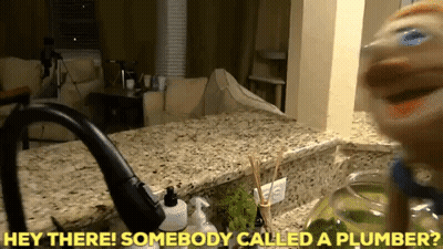 A Kitchen Counter With The Words Hey There Somebody Called A Plumber Above It GIF