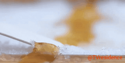 A Knife Is Cutting A Piece Of Jelly On A Cutting Board With The Words @Tvresidence In Red GIF