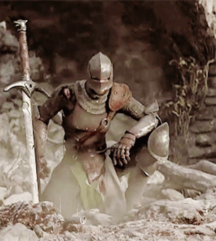 A Knight In Armor Holds A Large Sword In His Hand GIF