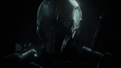A Knight In Armor Is Holding A Sword In A Dark Room GIF