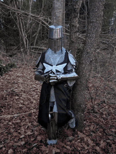 A Knight Leans Against A Tree In The Woods Holding A Sword GIF