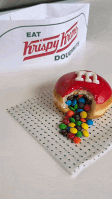 A Krispy Kreme Doughnut With A Hole In It GIF