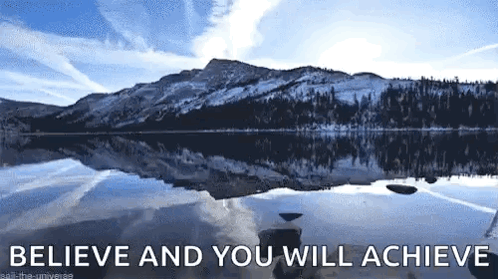 A Lake With Mountains In The Background And The Words `` Believe And You Will Achieve '' Above It GIF