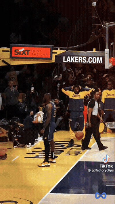 A Lakers Basketball Player Stands On The Court GIF