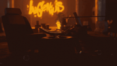 A Lamp Sits In Front Of A Neon Sign That Says ' Hype 'S ' GIF
