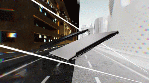 A Laptop Is Laying On Its Side On A Street GIF