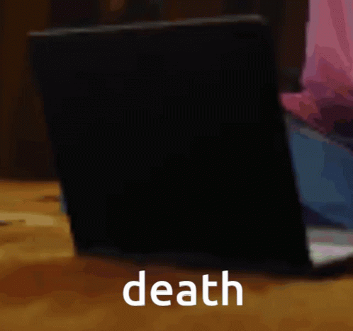 A Laptop Is Sitting On A Table With The Word Death Written On The Bottom GIF