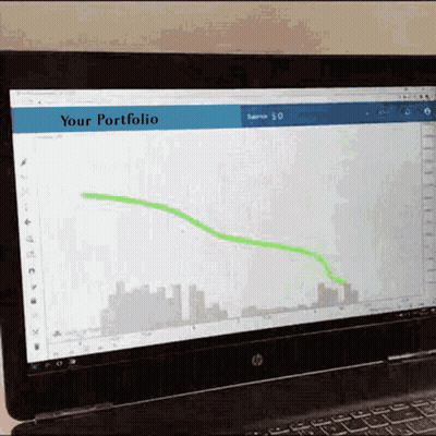 A Laptop Screen Shows A Graph And The Words " Your Portfolio " GIF