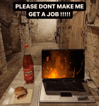 A Laptop Sits On A Table Next To A Coca Cola Bottle And A Hamburger GIF