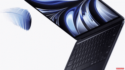 A Laptop With A Feather On The Screen And A White Background GIF