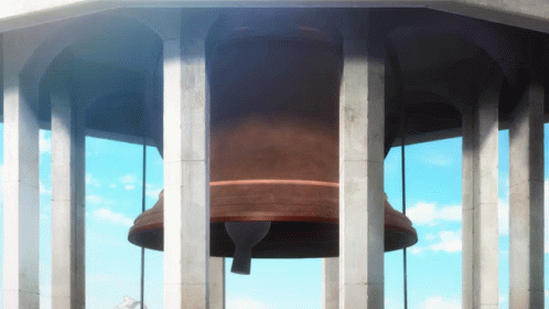 A Large Bell Is Hanging From A Tower With Pillars GIF