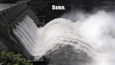 A Large Body Of Water Is Coming Down A Dam With The Words Damn Written On The Bottom GIF