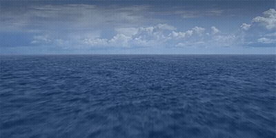 A Large Body Of Water With A Blue Sky And Clouds In The Background GIF
