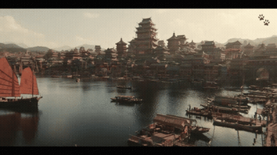 A Large Body Of Water With Boats In It And A City In The Background GIF