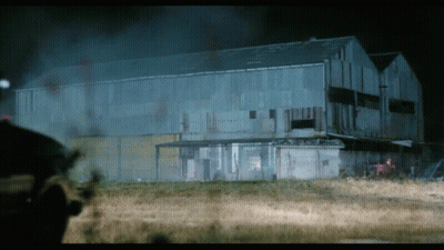 A Large Building With A Lot Of Smoke Coming Out Of It At Night GIF