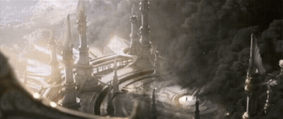 A Large Building With A Sign That Says ' A ' On It Is Surrounded By Clouds GIF