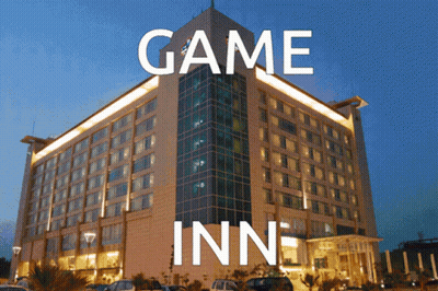 A Large Building With Game Inn Written On It GIF