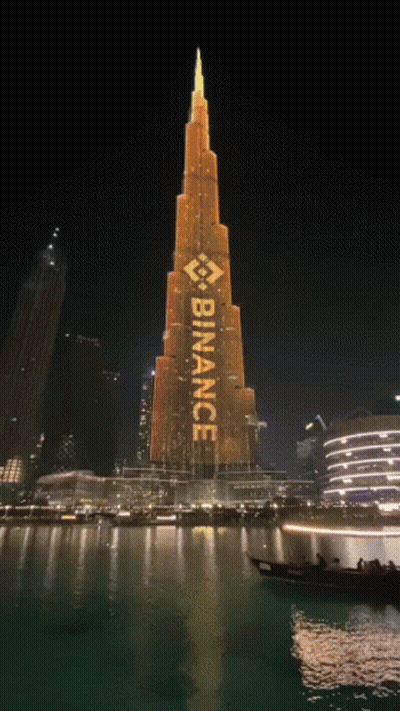 A Large Building With The Word Binance Written On It GIF