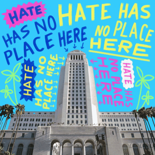 A Large Building With The Words Hate Has No Place Here GIF