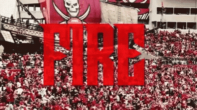 A Large Crowd Of People Are Gathered In A Stadium With The Word Fire In The Foreground . GIF