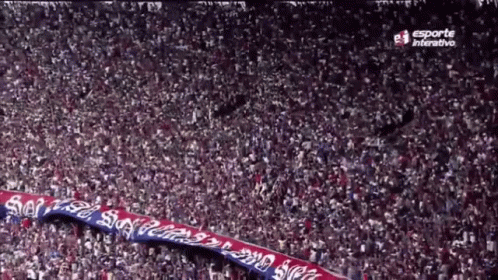 A Large Crowd Of People In A Stadium With Esporte Interactive On The Bottom Right GIF