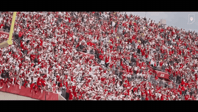 A Large Crowd Of People In A Stadium With The Number 25 On The Bleachers GIF