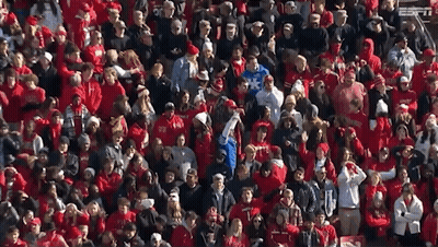 A Large Crowd Of People Wearing Red Shirts With Espn On The Bottom Left GIF