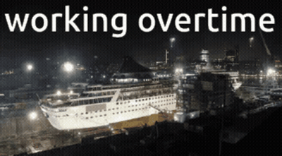 A Large Cruise Ship Is Being Built At Night And The Words Working Overtime Are Above It GIF