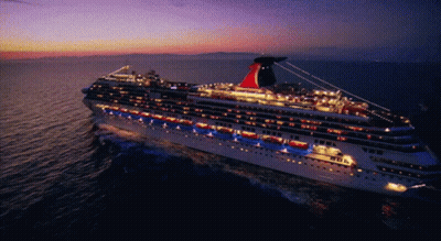 A Large Cruise Ship Is Floating In The Ocean GIF