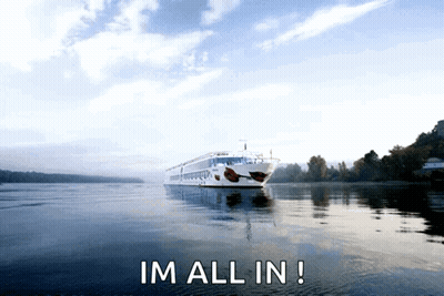 A Large Cruise Ship Is Floating On A Body Of Water With The Words Im All In Below It GIF