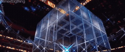 A Large Cube In A Stadium With The Word Hell On It GIF