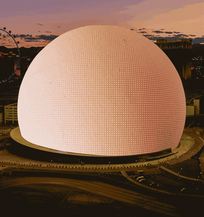 A Large Dome With A Lot Of Lights On It Is Lit Up At Night GIF
