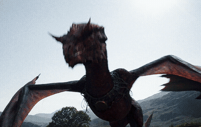 A Large Dragon With Wings Is Flying In The Air GIF