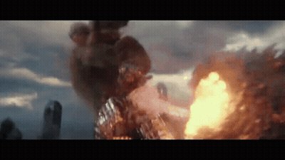 A Large Explosion Is Taking Place In A City With A Lot Of Fire Coming Out Of It . GIF