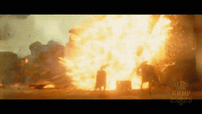 A Large Explosion Is Taking Place In The Middle Of A City . GIF