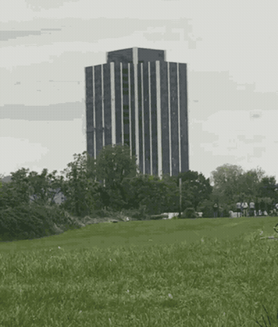 A Large Explosion Is Taking Place In The Middle Of A Field GIF