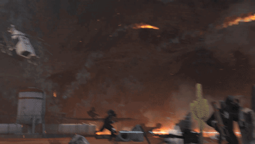 A Large Explosion With A Lot Of Smoke And Flames GIF