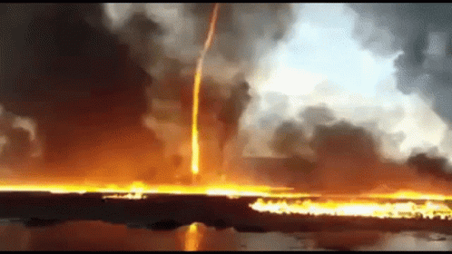 A Large Fire Is Coming Out Of The Ground And A Lightning Bolt Is Coming From The Sky . GIF
