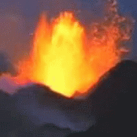 A Large Fireball Is Erupting From A Volcano In The Night Sky GIF
