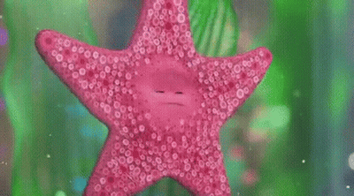 A Large Fish Tank With A Ship In The Middle Of It GIF