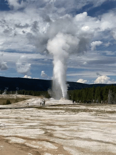 A Large Geyser Is Erupting In The Middle Of A Desert GIF