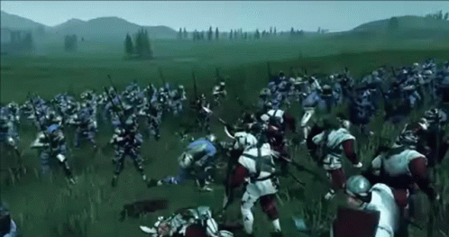 A Large Group Of Medieval Soldiers Are Fighting In A Field . GIF