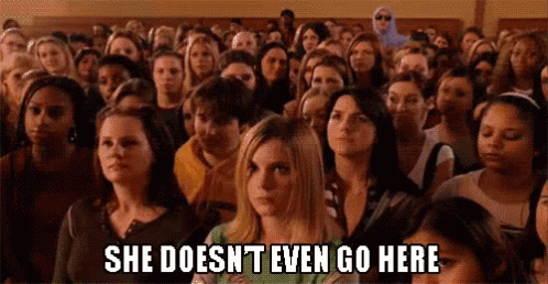 A Large Group Of People Are Sitting In A Classroom . GIF