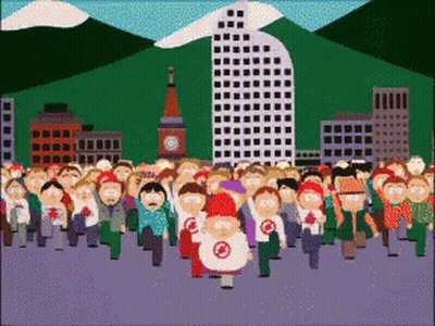A Large Group Of People Are Walking In A City With A Clock Tower In The Background GIF