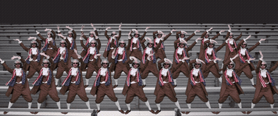 A Large Group Of People Wearing Sunglasses Are Standing In A Row GIF