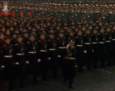 A Large Group Of Soldiers Marching With The Number 7 On Their Shirts GIF