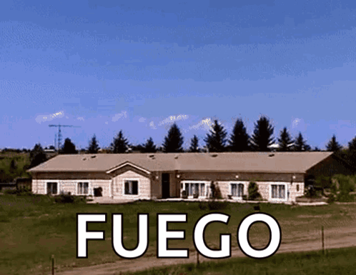 A Large House With Fuego Written On The Front GIF