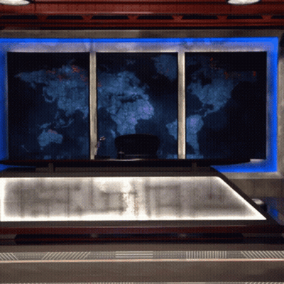 A Large Map Of The World Hangs On A Wall Above A Desk GIF